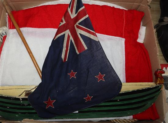 Three flags / pennants and a model boat